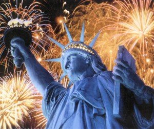 The Statue of Liberty with fireworks behind it
